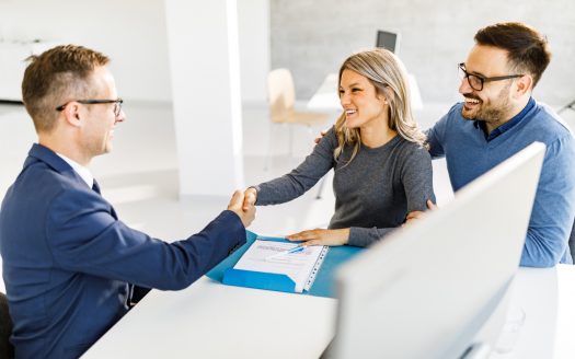 estate agent and client shaking hands