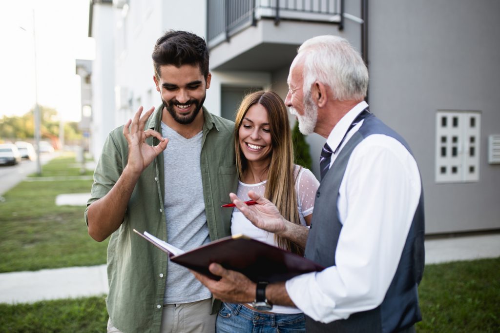 property-manager-and-client-outside-a-building