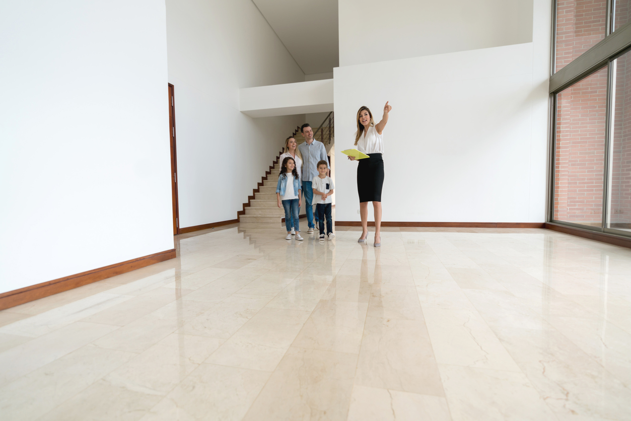 family viewing a spacious apartment