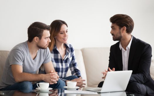 landlords in discussion with estate agent